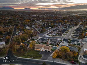 Aerial view of property's location with nearby suburban area and a mountain backdrop