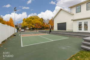 View of tennis court with french doors