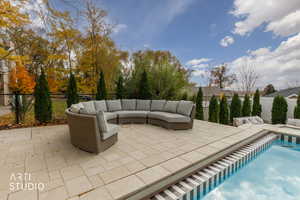 Fenced backyard with a patio area and an outdoor hangout area