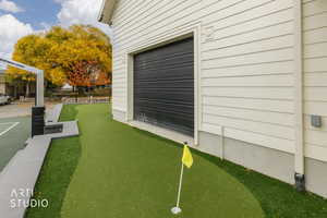 View of yard featuring an area to practice putting