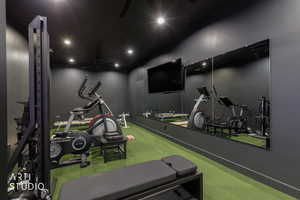 Gym featuring recessed lighting and mirrors