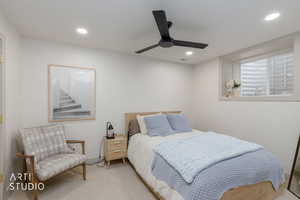 Bedroom with carpet floors, a ceiling fan, and recessed lighting