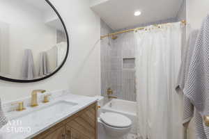 Full bath featuring vanity, shower / bath combination with curtain, and recessed lighting
