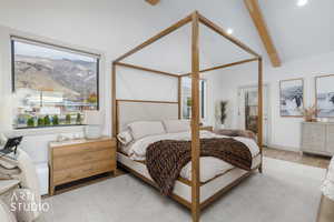 Bedroom with wood finished floors and access to exterior