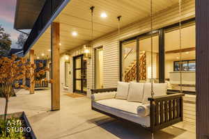 Patio terrace at dusk featuring an outdoor hangout area and a patio