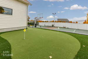 View of yard featuring a putting area