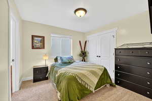 Bedroom with carpet floors and a closet