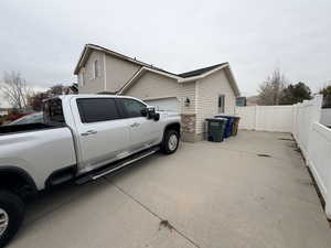 View of home's exterior featuring driveway and a garage