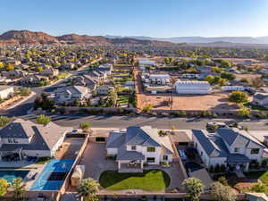 Aerial perspective of suburban area featuring a mountain backdrop