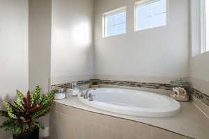 Full bath featuring a garden tub