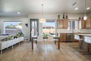 Dining space featuring recessed lighting
