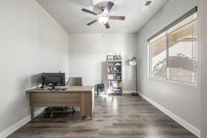 Office area with wood finished floors and a ceiling fan