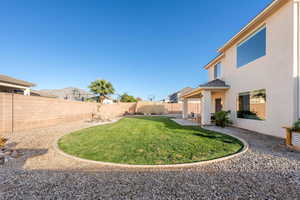 Fenced backyard featuring a patio area