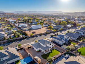 Aerial perspective of suburban area featuring a mountainous background