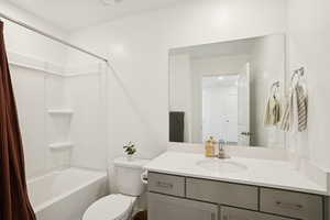 Full bath with shower / bathtub combination with curtain and vanity