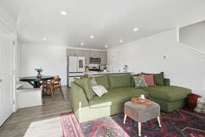 Living area featuring recessed lighting and light wood-style flooring