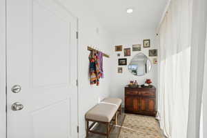 Hall featuring wood finished floors