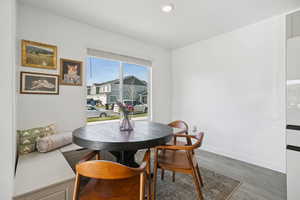 Dining room featuring wood finished floors and recessed lighting
