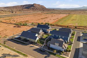 Aerial perspective of suburban area with a mountainous background