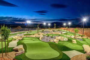 View of property's community with an area to practice putting