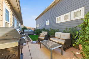 View of patio featuring a grill and an outdoor hangout area