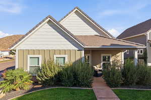 Bungalow with board and batten siding and a mountain view