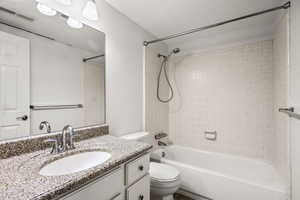 Bathroom with shower / tub combination and vanity