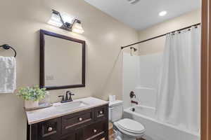Full bathroom featuring vanity and shower / tub combo