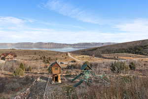 View of mountain backdrop featuring a large body of water