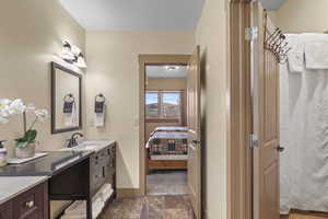 Full bathroom featuring vanity, ensuite bathroom, and a shower with shower curtain