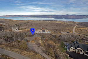 Aerial overview of property's location featuring a water and mountain view