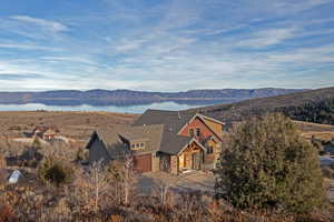 View of mountain backdrop featuring a nearby body of water