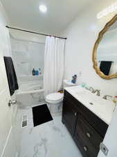 Bathroom with vanity, shower / tub combo, light marble finish flooring, and recessed lighting