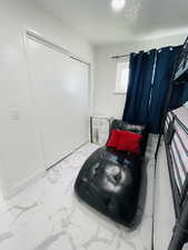 Sitting room with light marble finish floors