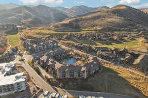 View of property location featuring a golf course and mountains