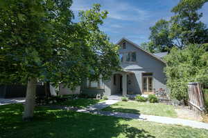 View of front of home with stucco siding and french doors