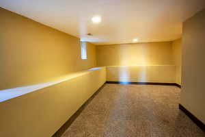 Unfurnished room with baseboards and recessed lighting