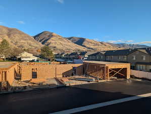 View of mountain background featuring nearby suburban area