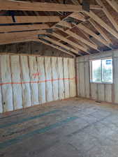 Misc room featuring lofted ceiling