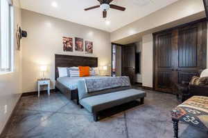 Bedroom featuring concrete floors, ceiling fan, and recessed lighting