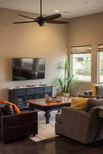 Living area featuring ceiling fan, recessed lighting, and tile patterned flooring