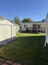 Fenced backyard with a shed