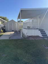 View of green lawn with a shed