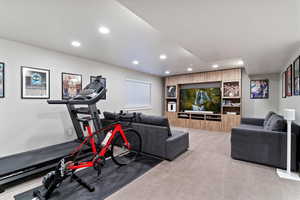 Exercise area featuring carpet floors and recessed lighting