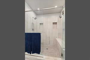 Full bath with a stall shower and recessed lighting