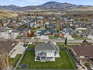 Aerial perspective of suburban area featuring a mountainous background