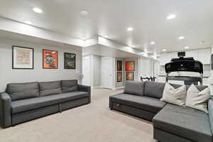 Living area featuring carpet flooring and recessed lighting