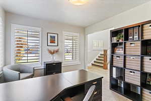 Office area with a textured ceiling
