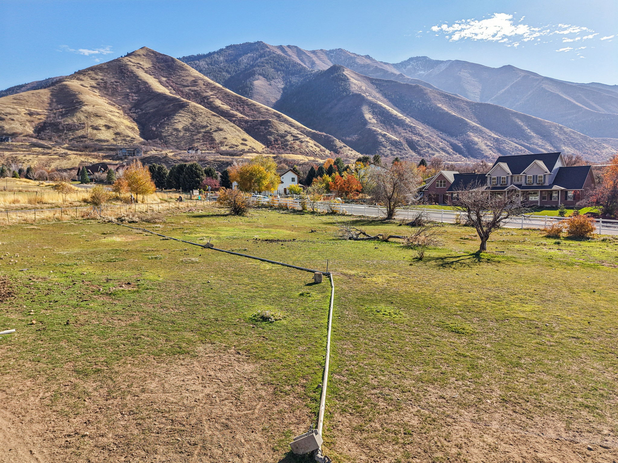View of mountain backdrop featuring rural landscape and a pastoral area