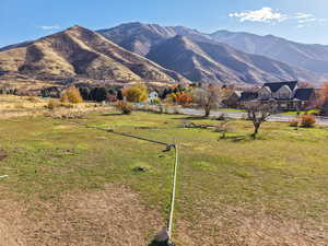 View of mountain backdrop featuring rural landscape and a pastoral area